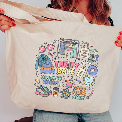 Person holding a tote bag with 'Thrift Babe Vintage Queen Good Finds Only' design.