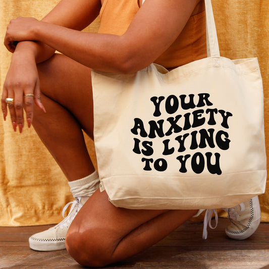 Your anxiety is lying tote bag